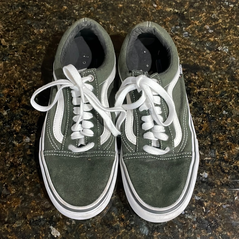 Vans Old Skool army green canvas sneakers.